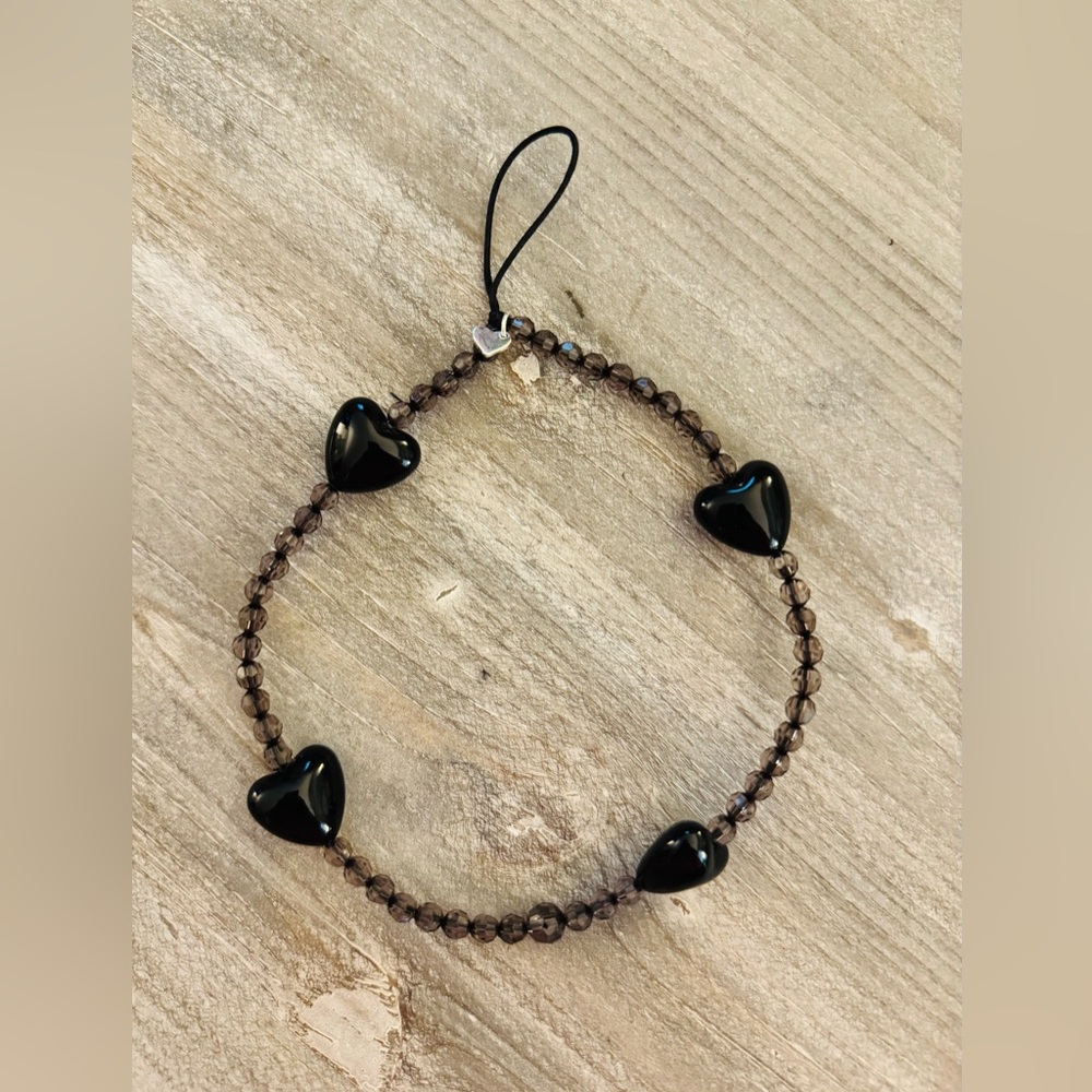 Velvet Caviar phone charm, beaded with black heart details, wrist strap